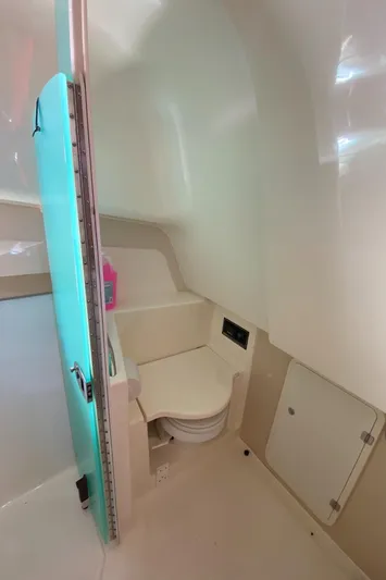  Yacht Photos Pics 2009 Pursuit OS 375 Offshore boat interior bathroom with compact design and modern amenities.