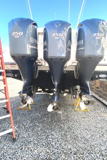  Yacht Photos Pics 2009 Pursuit OS 375 Offshore with triple Yamaha 350 engines on gravel.