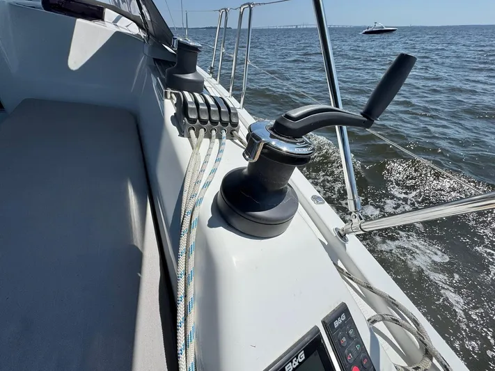 Ahyoka Yacht Photos Pics Sailing on a 2017 Hanse 345 yacht, featuring winch and control panel, with ocean view.