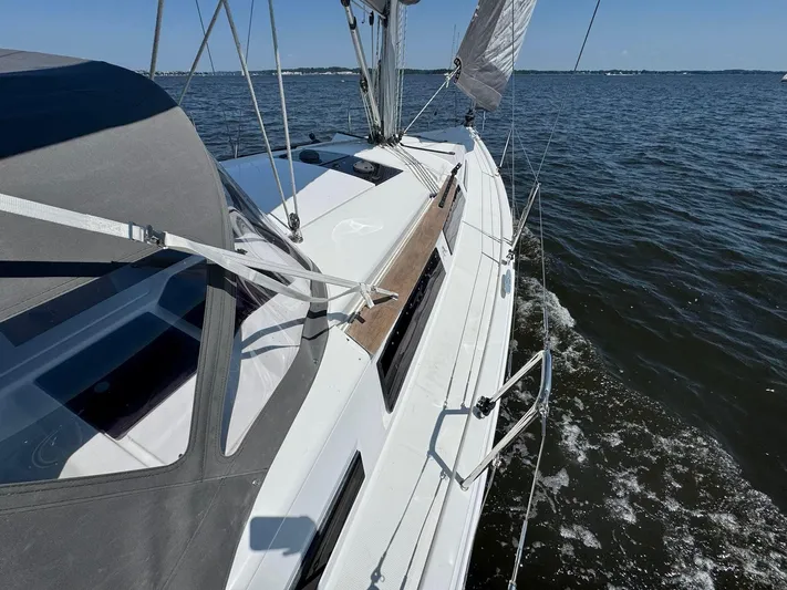 Ahyoka Yacht Photos Pics Sailing on a 2017 Hanse 345 yacht, gliding through calm waters under clear skies.