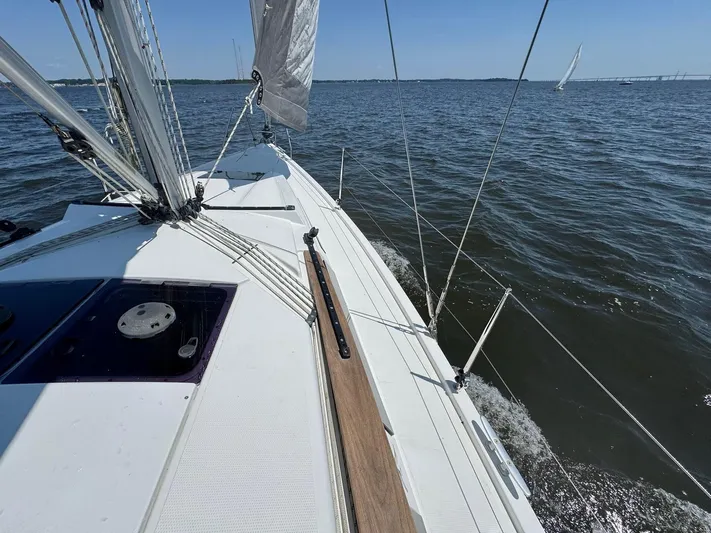 Ahyoka Yacht Photos Pics Sailing on a 2017 Hanse 345 yacht, gliding through calm waters under clear skies.