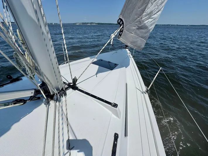 Ahyoka Yacht Photos Pics Sailing on a 2017 Hanse 345 yacht, gliding through calm waters under clear skies.