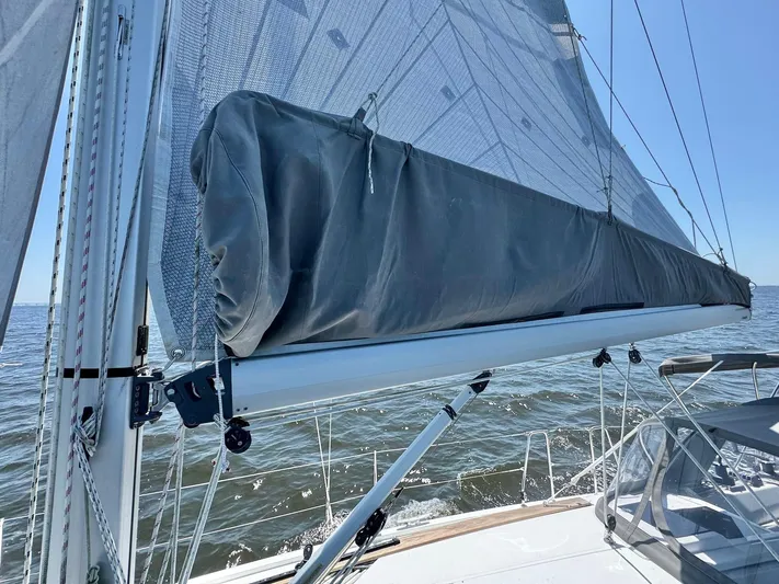 Ahyoka Yacht Photos Pics Sailboat Hanse 345 (2017) with mainsail cover on calm sea.