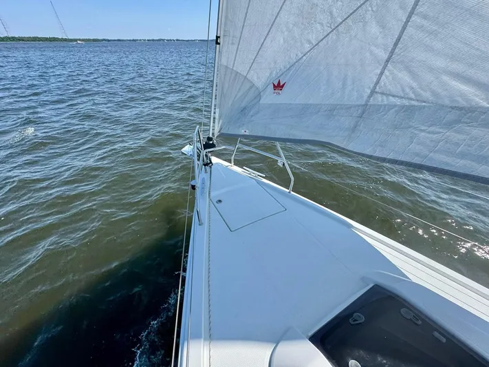 Ahyoka Yacht Photos Pics Sailing on a 2017 Hanse 345 yacht, gliding through calm waters under clear skies.