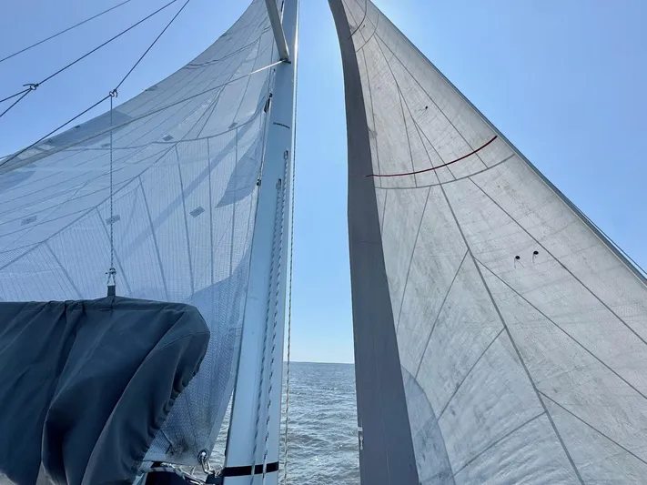 Ahyoka Yacht Photos Pics Sailing on a 2017 Hanse 345 yacht with full sails against a clear blue sky.