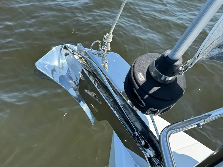 Ahyoka Yacht Photos Pics Bow of 2017 Hanse 345 yacht with anchor and water view.