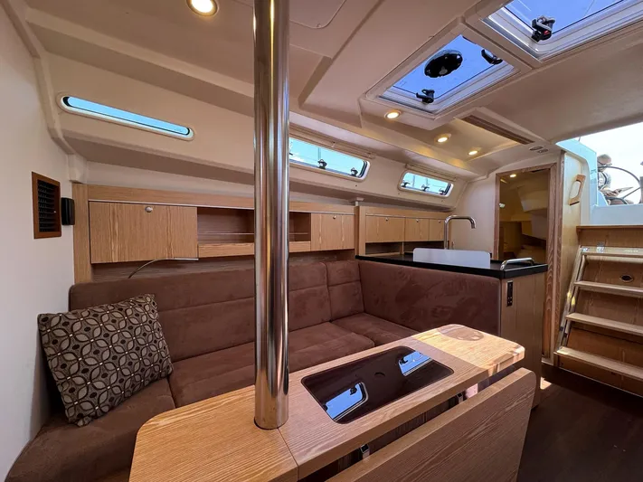 Ahyoka Yacht Photos Pics Interior of 2017 Hanse 345 yacht with modern wood finish and skylights.