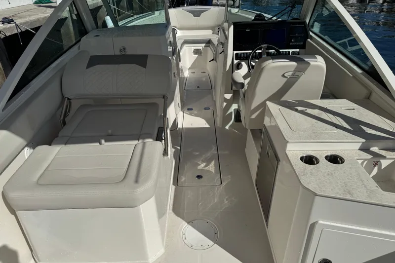  Yacht Photos Pics 2025 Sailfish 276 DC boat interior with seating, helm, and console.