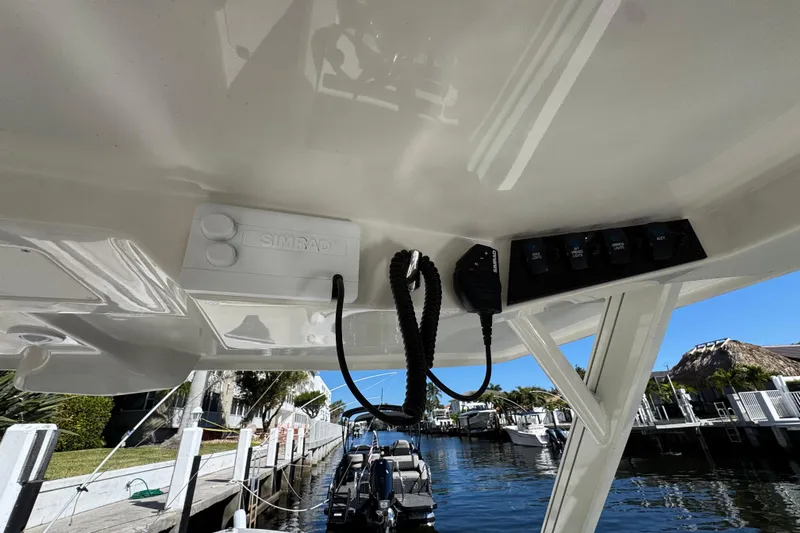  Yacht Photos Pics 2025 Sailfish 276 DC boat dashboard with Simrad electronics and control panel.
