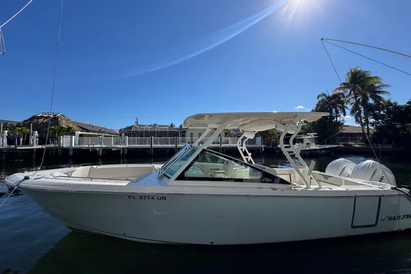  Yacht Photos Pics 2025 Sailfish 276 DC boat docked under clear blue sky.