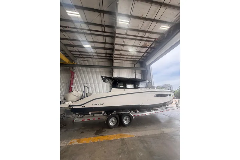  Yacht Photos Pics 2026 Navan C30 boat on trailer inside a large warehouse.