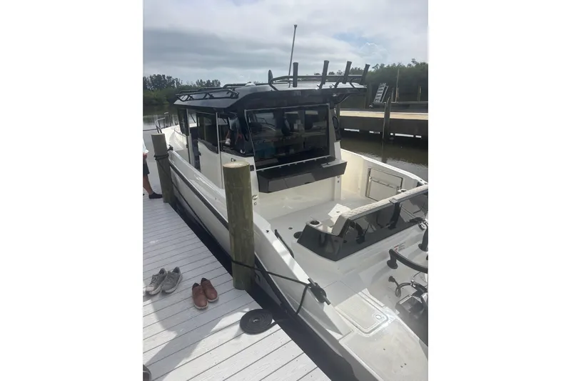  Yacht Photos Pics 2026 Navan C30 boat docked, featuring sleek design and spacious deck area.