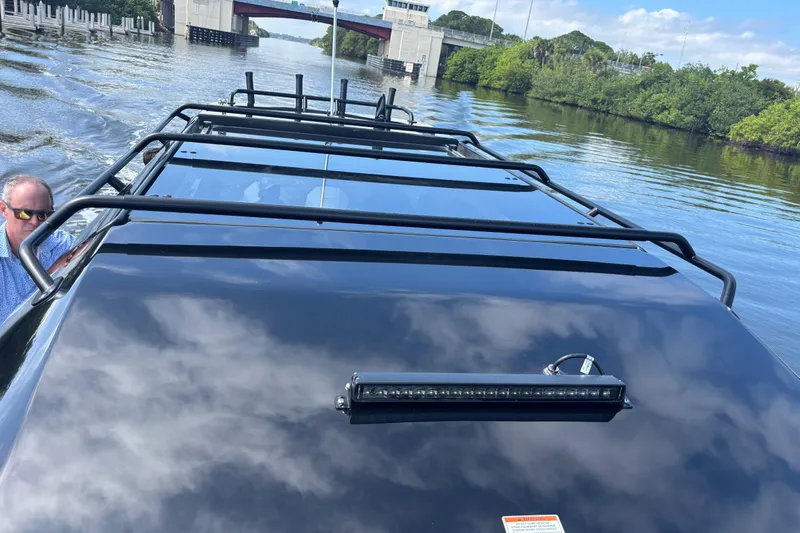  Yacht Photos Pics Navan C30 2026 vehicle on water, showcasing roof design and scenic background.