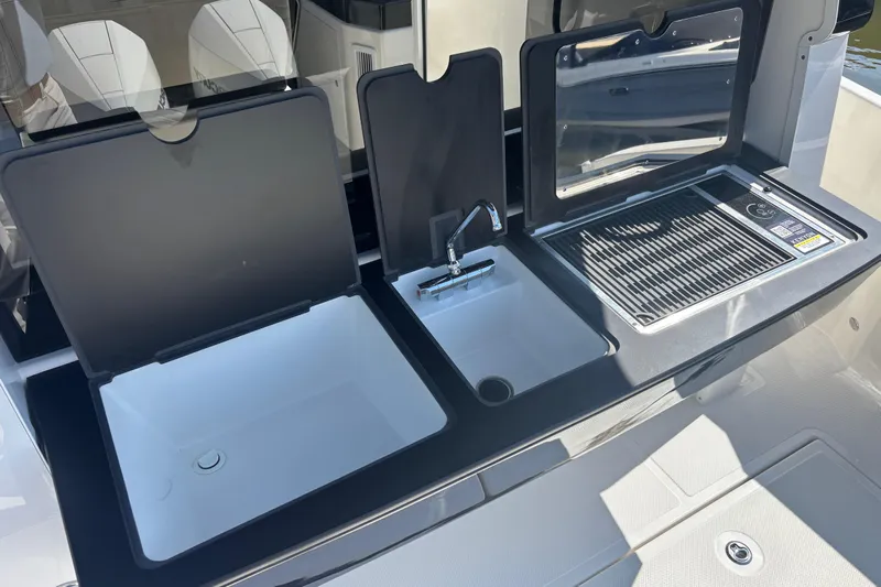  Yacht Photos Pics Outdoor kitchen setup on 2026 Navan C30 boat with sink and grill.