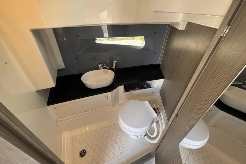  Yacht Photos Pics Compact bathroom in 2026 Navan C30 with modern sink and toilet design.