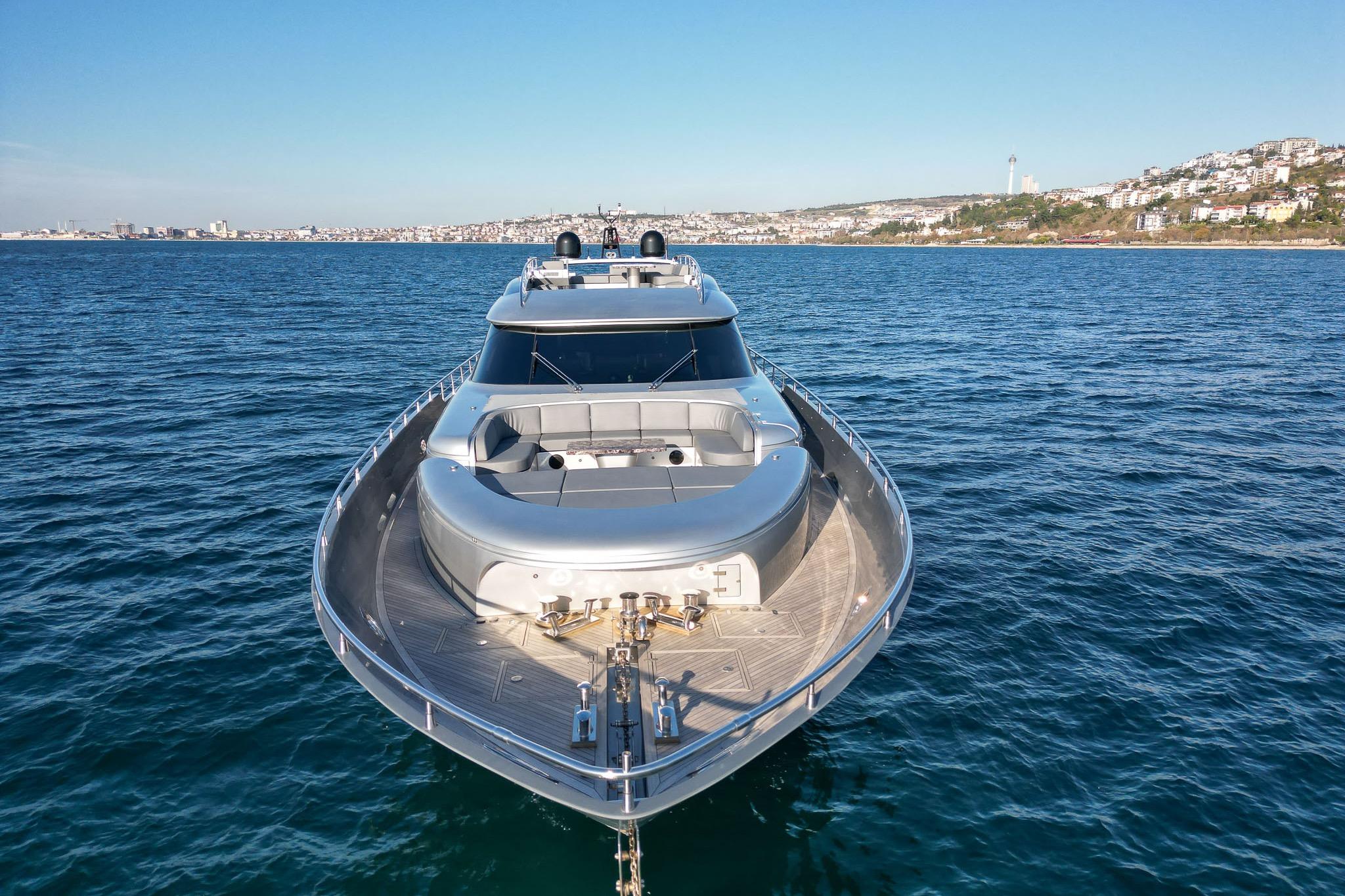 Luxury yacht Fipa Group AB 100, 2016 model, cruising on open sea near coastline.