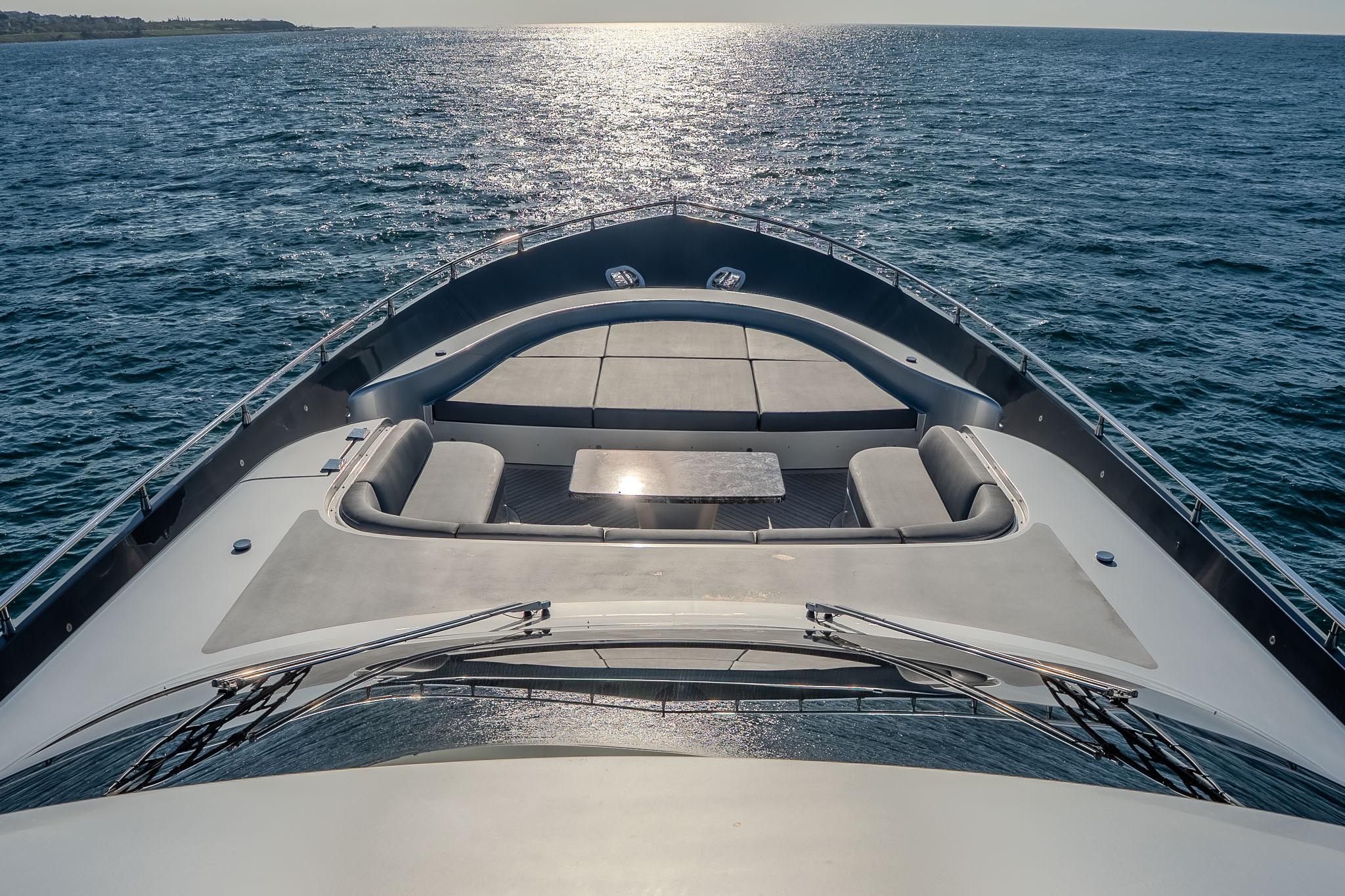 Luxurious 2016 Fipa Group AB 100 yacht cruising on open sea at sunset.