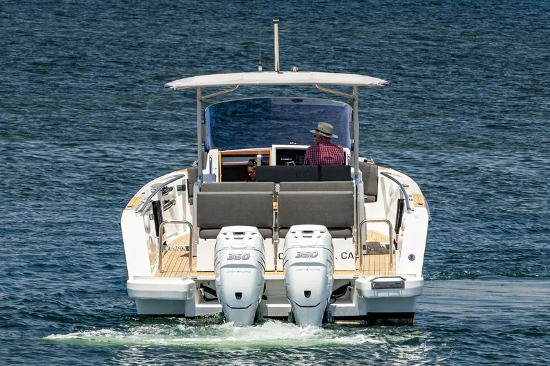 Intermezzo Yacht Photos Pics 2018 Fjord 36 Xpress boat cruising on open water, rear view.