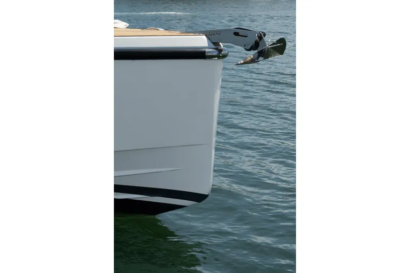 Intermezzo Yacht Photos Pics Bow of 2018 Fjord 36 Xpress yacht with anchor over water.