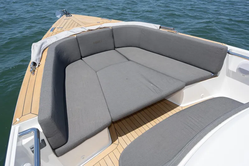 Intermezzo Yacht Photos Pics 2018 Fjord 36 Xpress boat with spacious gray cushioned seating on deck.