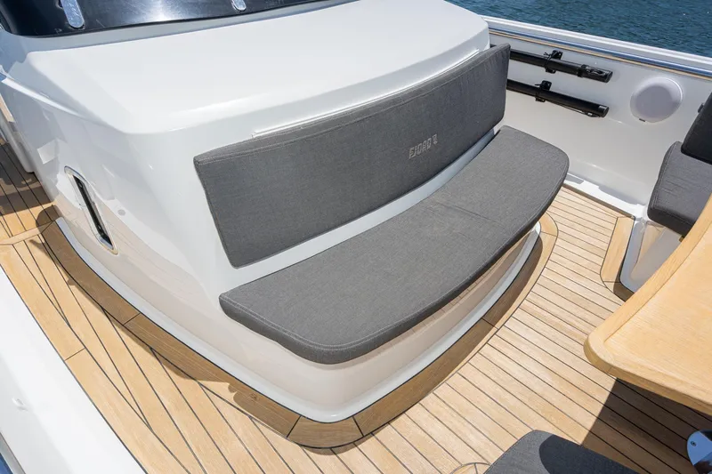 Intermezzo Yacht Photos Pics 2018 Fjord 36 Xpress boat with cushioned seating and teak deck.