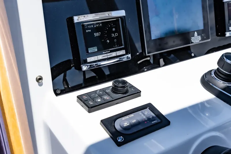Intermezzo Yacht Photos Pics Control panel of 2018 Fjord 36 Xpress boat with digital displays and navigation controls.