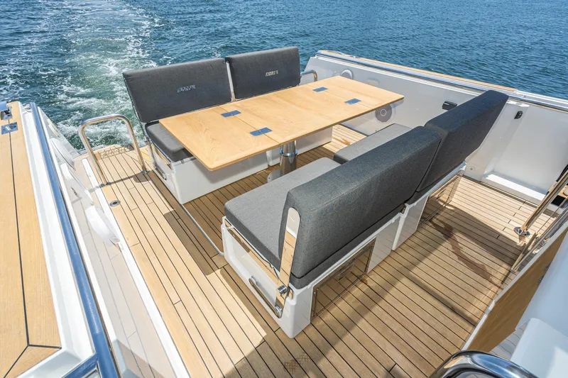Intermezzo Yacht Photos Pics 2018 Fjord 36 Xpress yacht with elegant teak deck and modern seating arrangement.