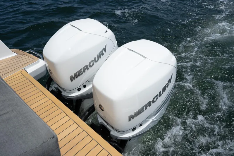 Intermezzo Yacht Photos Pics Twin Mercury outboard engines on a 2018 Fjord 36 Xpress boat in water.
