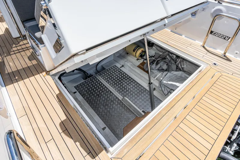 Intermezzo Yacht Photos Pics Open storage compartment on 2018 Fjord 36 Xpress boat with teak deck.