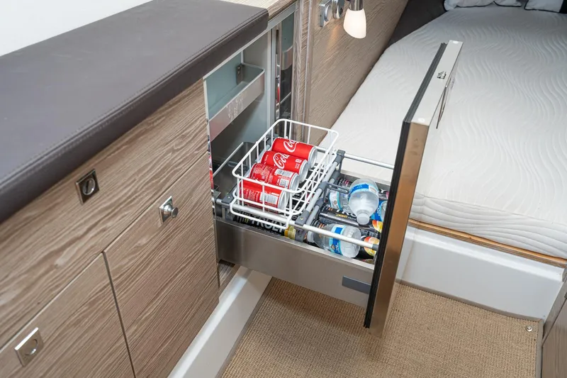 Intermezzo Yacht Photos Pics 2018 Fjord 36 Xpress interior with open drawer fridge, stocked with drinks.