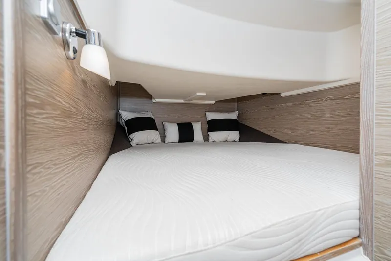 Intermezzo Yacht Photos Pics Cozy cabin interior of 2018 Fjord 36 Xpress with modern bedding and ambient lighting.