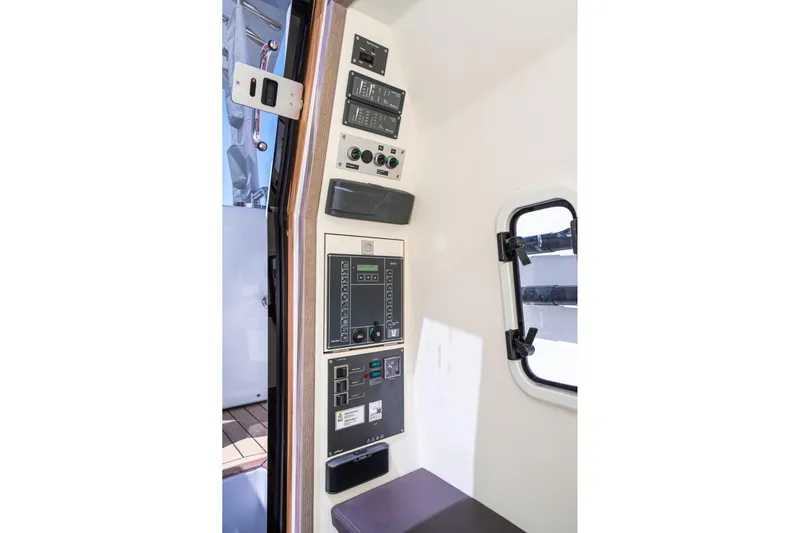 Intermezzo Yacht Photos Pics Control panel inside 2018 Fjord 36 Xpress boat, featuring various switches and displays.