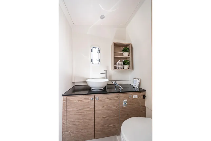 Intermezzo Yacht Photos Pics Modern bathroom interior of 2018 Fjord 36 Xpress yacht with sleek sink and storage.