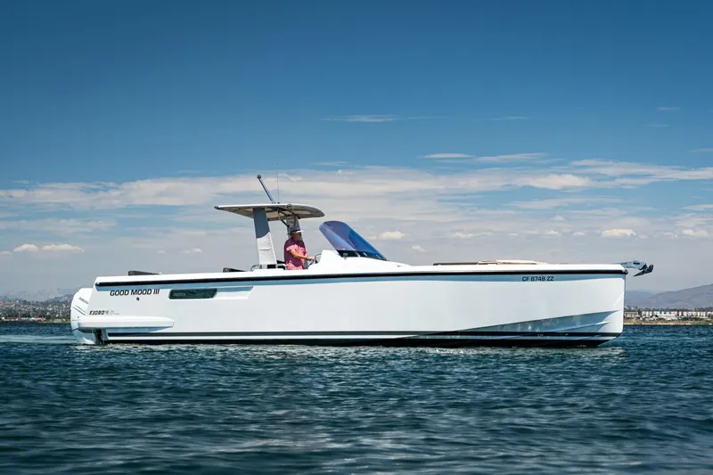 Intermezzo Yacht Photos Pics 2018 Fjord 36 Xpress boat cruising on calm waters under a clear blue sky.