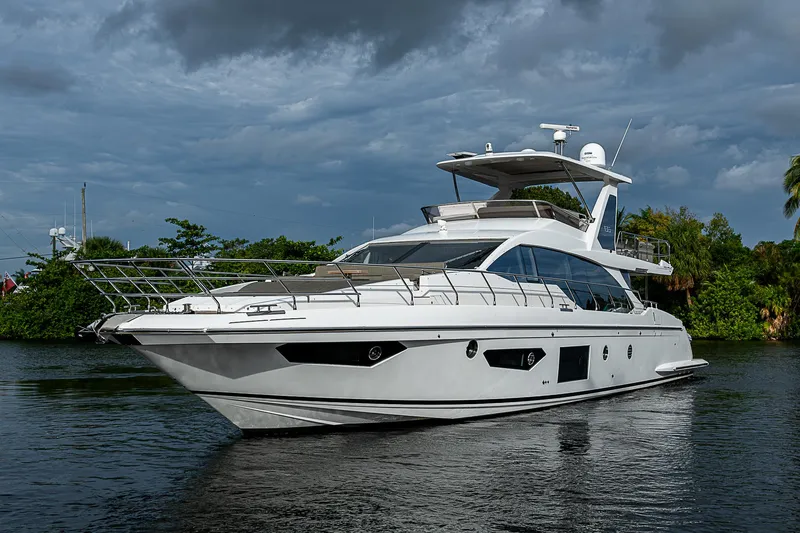 Evado Yacht Photos Pics 2020 Azimut 66 yacht on calm water under cloudy sky.