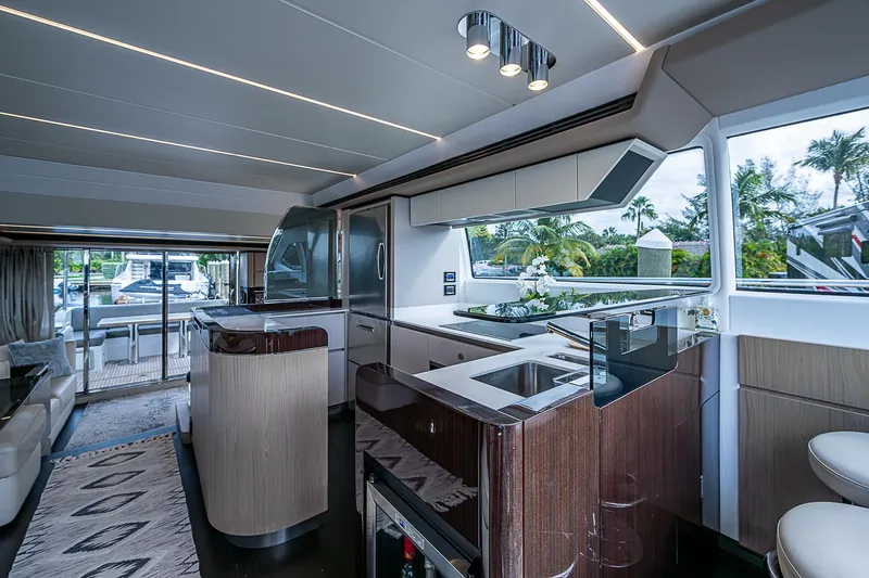 Evado Yacht Photos Pics Luxurious interior of 2020 Azimut 66 yacht with modern kitchen and scenic views.