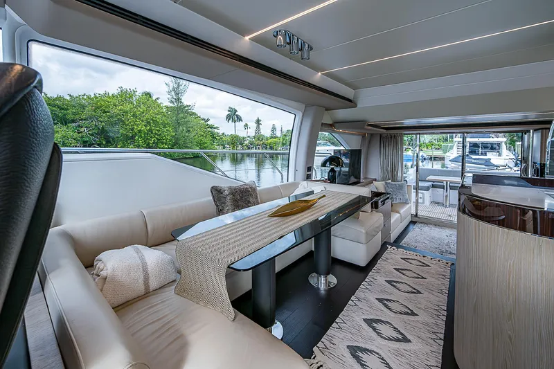Evado Yacht Photos Pics Luxurious interior of 2020 Azimut 66 yacht with elegant seating and scenic views.