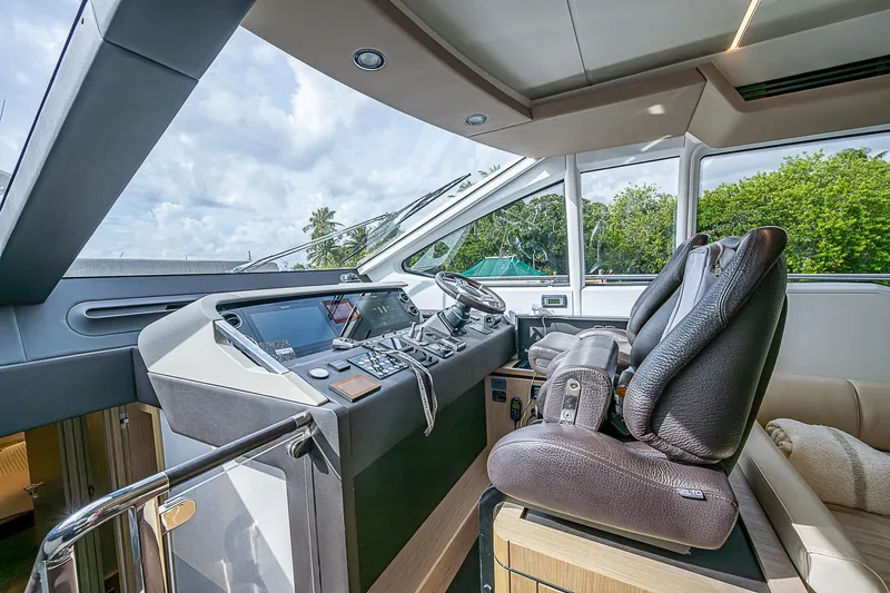 Evado Yacht Photos Pics Luxurious 2020 Azimut 66 yacht cockpit with modern controls and plush seating.