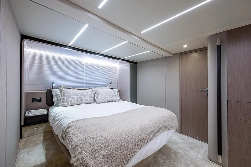 Evado Yacht Photos Pics Luxurious bedroom interior of 2020 Azimut 66 yacht with modern design and cozy bedding.