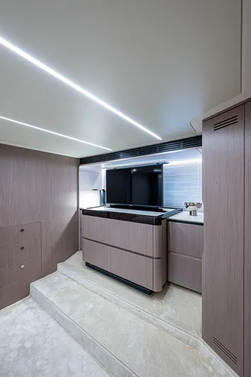 Evado Yacht Photos Pics Luxurious interior of 2020 Azimut 66 yacht with modern cabinetry and sleek design.