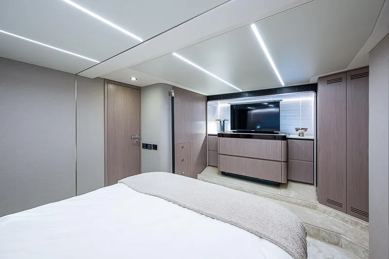 Evado Yacht Photos Pics Luxurious bedroom interior of 2020 Azimut 66 yacht with modern design and TV.