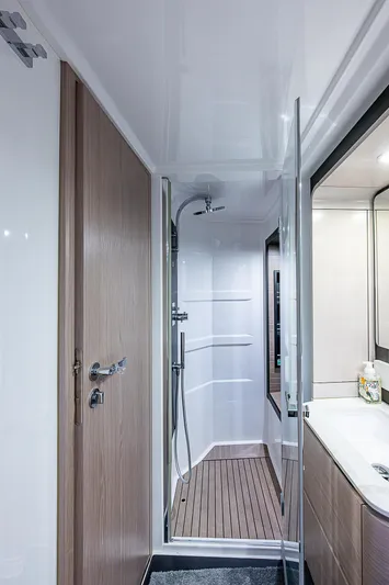 Evado Yacht Photos Pics Modern bathroom interior on 2020 Azimut 66 yacht, featuring sleek shower and vanity.