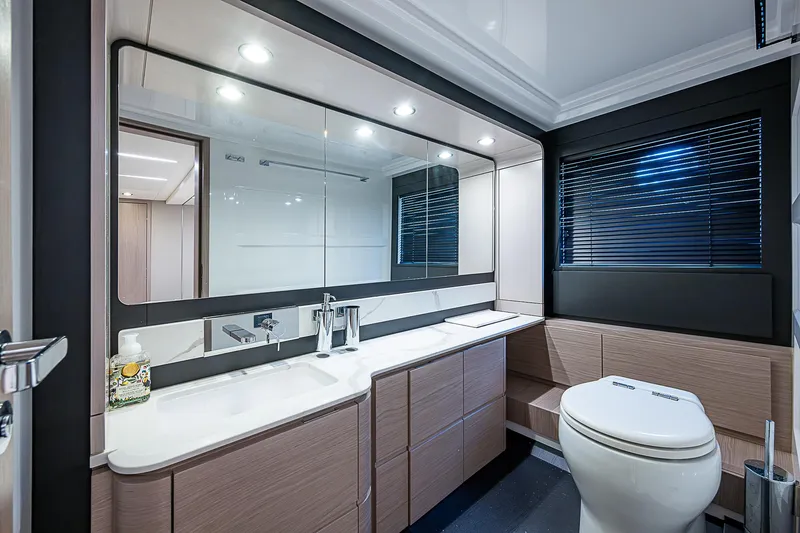 Evado Yacht Photos Pics Luxurious bathroom interior of 2020 Azimut 66 yacht with modern fixtures and sleek design.