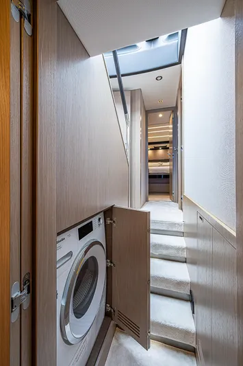 Evado Yacht Photos Pics Interior of 2020 Azimut 66 yacht with laundry area and modern design.