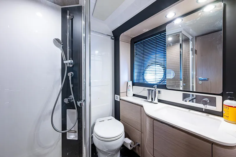 Evado Yacht Photos Pics Luxurious bathroom in 2020 Azimut 66 yacht with modern fixtures and shower.