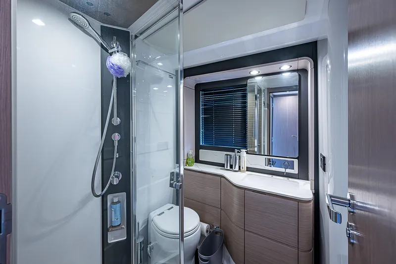 Evado Yacht Photos Pics Luxurious bathroom in 2020 Azimut 66 yacht with modern fixtures and elegant design.