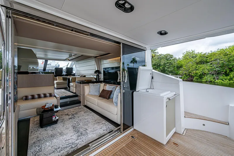 Evado Yacht Photos Pics Luxurious interior of 2020 Azimut 66 yacht with modern furnishings and spacious design.