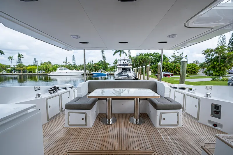 Evado Yacht Photos Pics Luxurious 2020 Azimut 66 yacht deck with elegant seating and table.