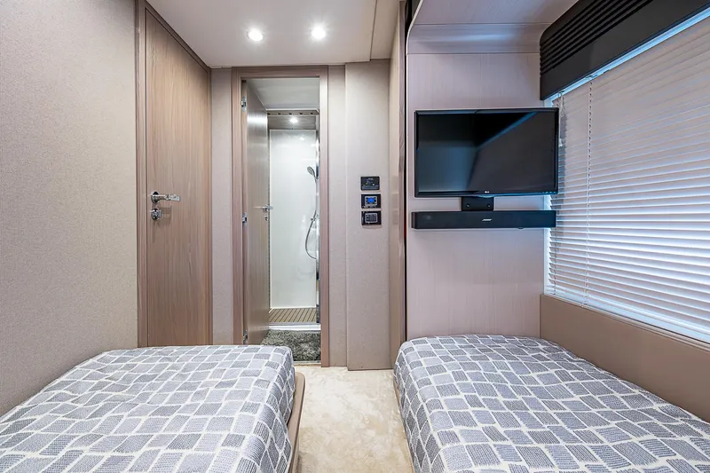 Evado Yacht Photos Pics Luxurious Azimut 66 yacht cabin interior with twin beds and modern amenities, 2020 model.