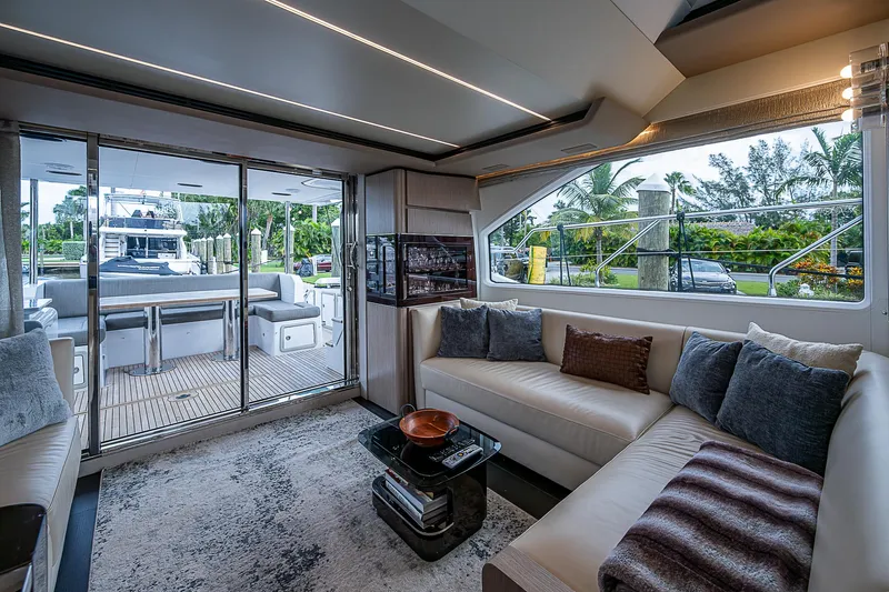 Evado Yacht Photos Pics Luxurious interior of 2020 Azimut 66 yacht with elegant seating and outdoor view.